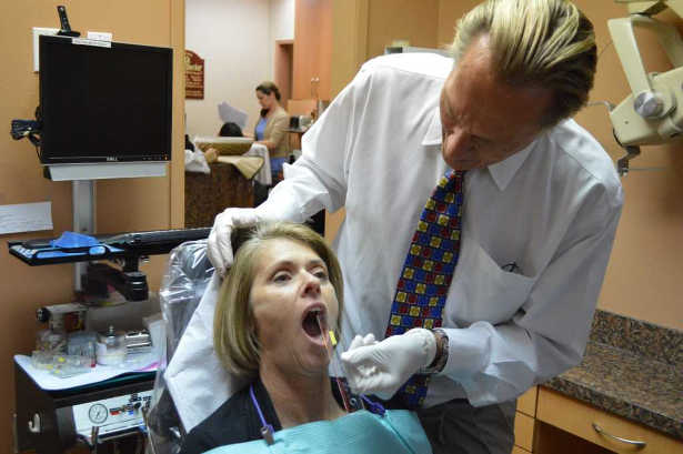 Dr. Peterson performing EMG muscle testing for TMJ diagnosis